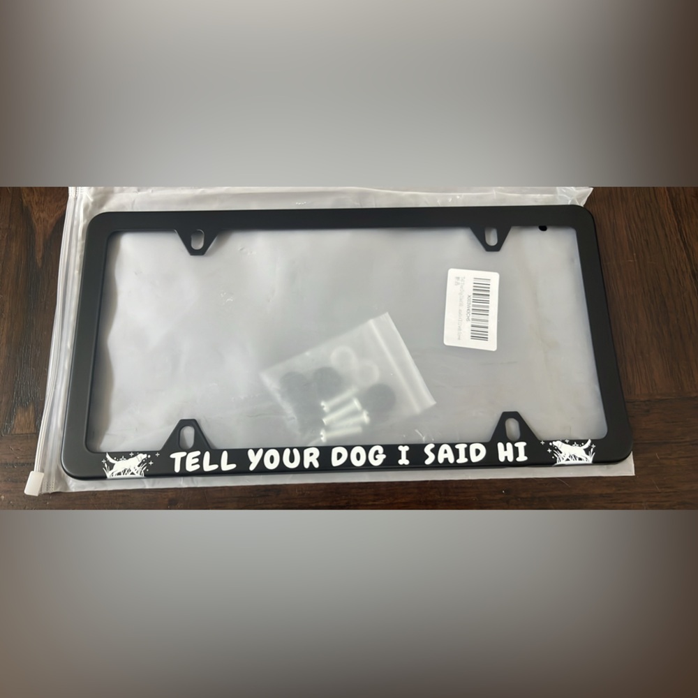 Black License Plate Frame with White Text